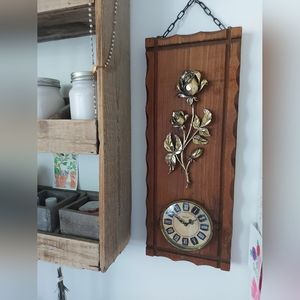 Mechanical clock decorated with roses.